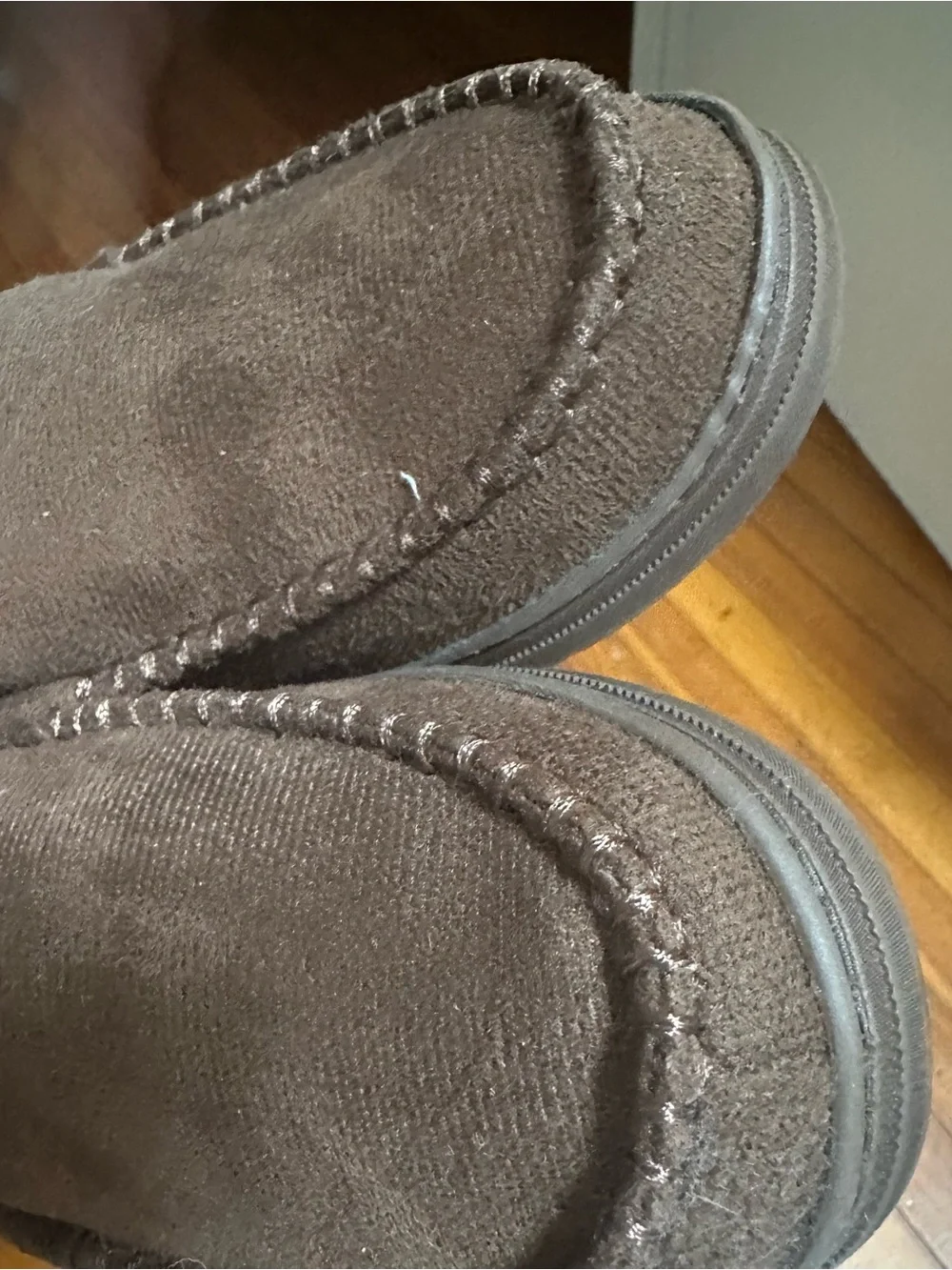 Mocassin-style slippers for men.